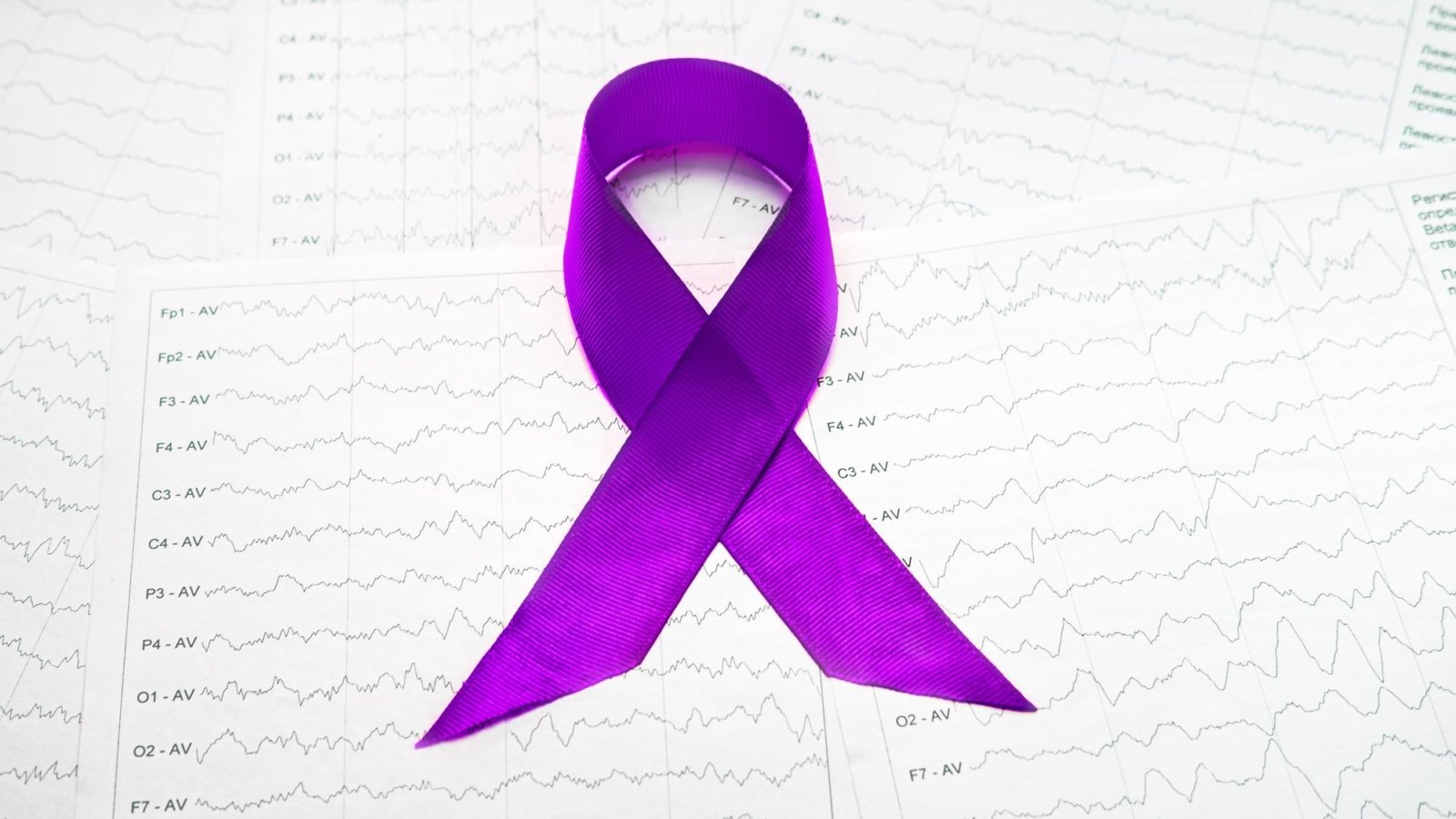 international-epilepsy-day-epilepsy-awareness-purple-ribbon-brain-wave-electroencephalogram-eeg-epilepsy_945447-5279